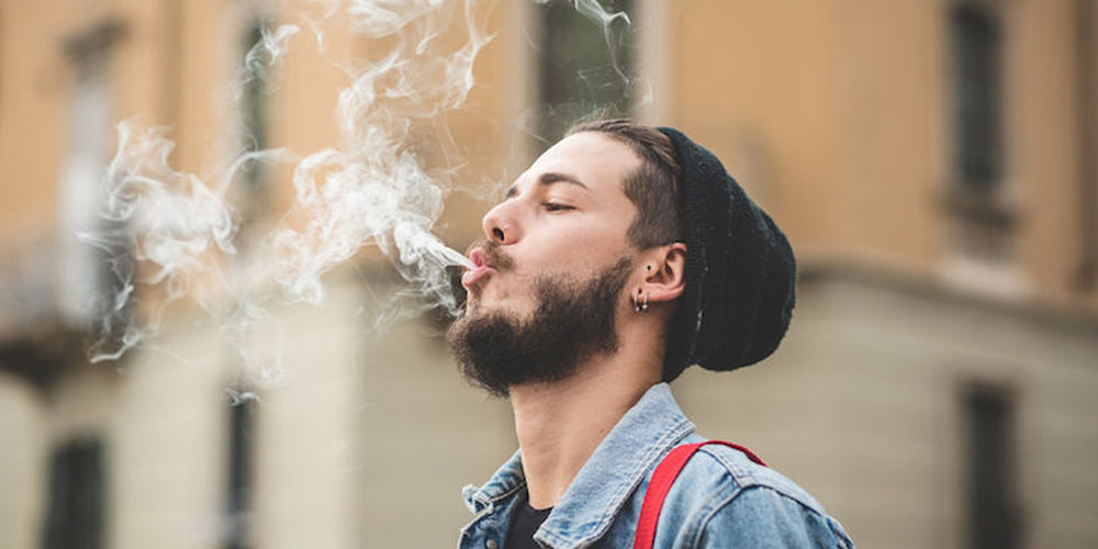 Man Blowing Smoke In Public
