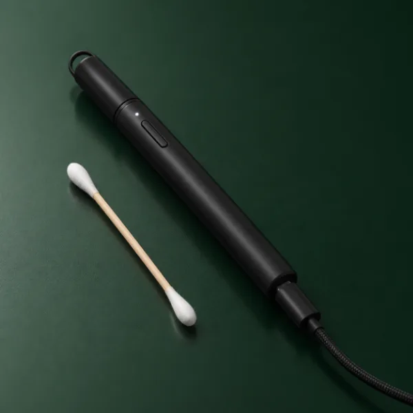 Puffco Hot Knife charging by USB-C next to a cotton swab