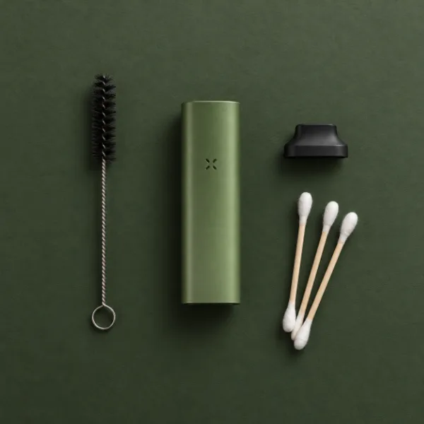 PAX Mini with a cleaning brush, swabs and spare mouthpiece